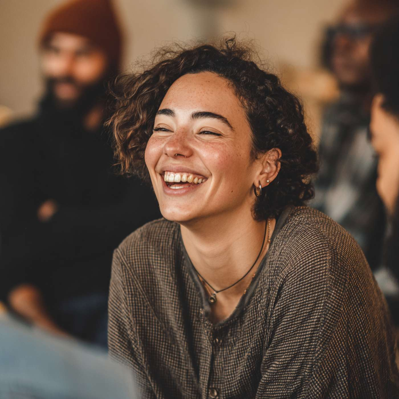 Smiling person in a supportive group setting, symbolizing positivity in ADHD counseling.