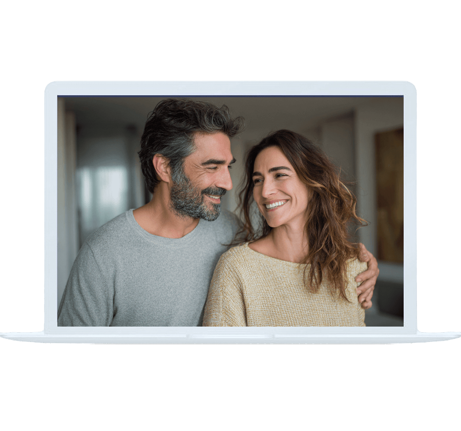 A smiling couple on a laptop screen, representing connection and support through online bipolar counseling.